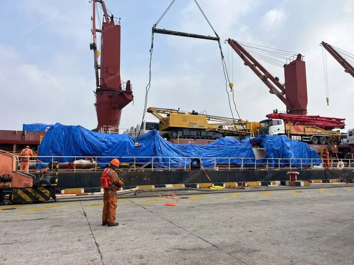 Crane arrive at the port and are loaded onto a cargo ship for sailing
