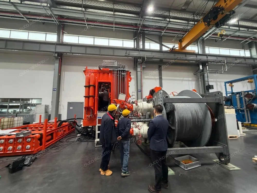OUCO technicians inspecting the crane AHC winch up close