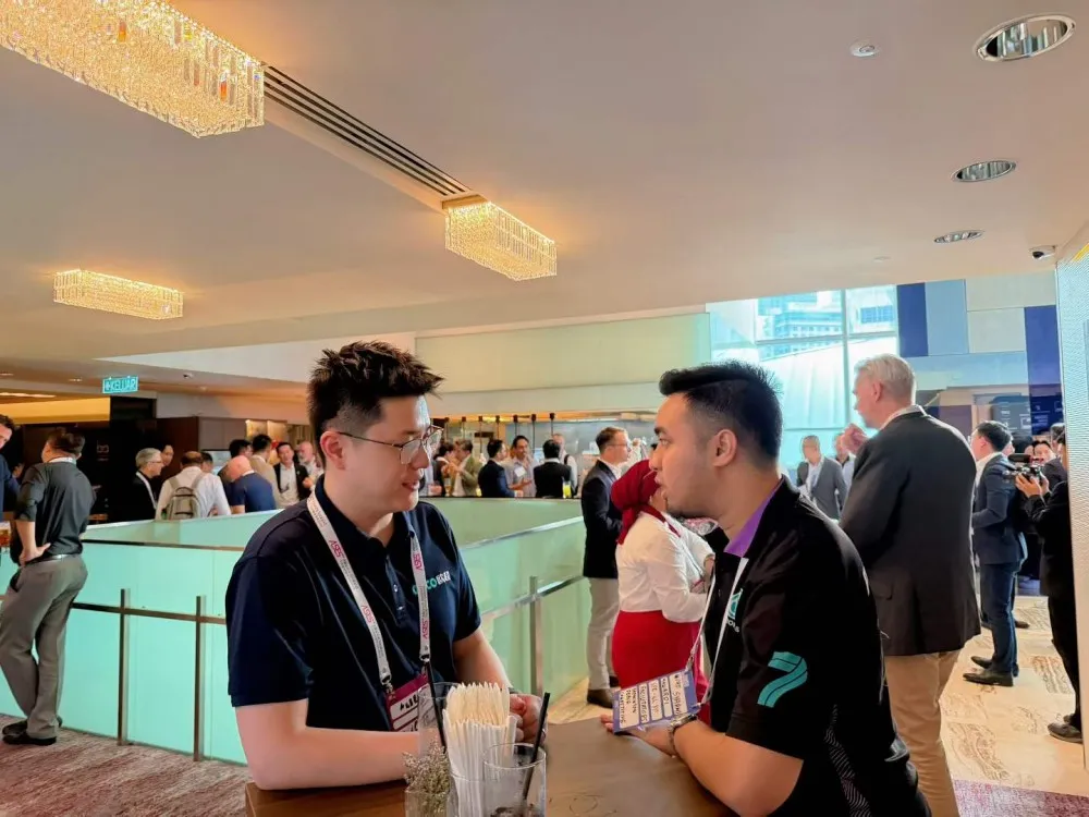 OUCO networking with industry professionals at OTC Asia exhibition