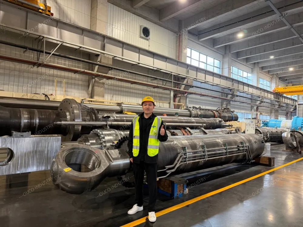 standing next to massive cylinders