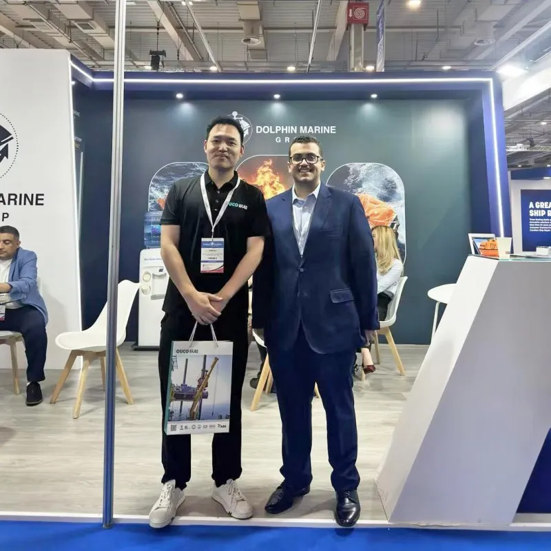 OUCO team visiting Dolphin Marine Group booth